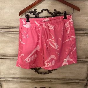 Nike mesh lined sportswear pink and white.